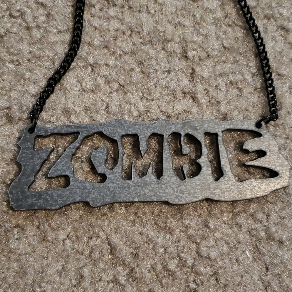 Zombie acrylic necklace jet black.